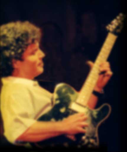 Chicoy playing guitar